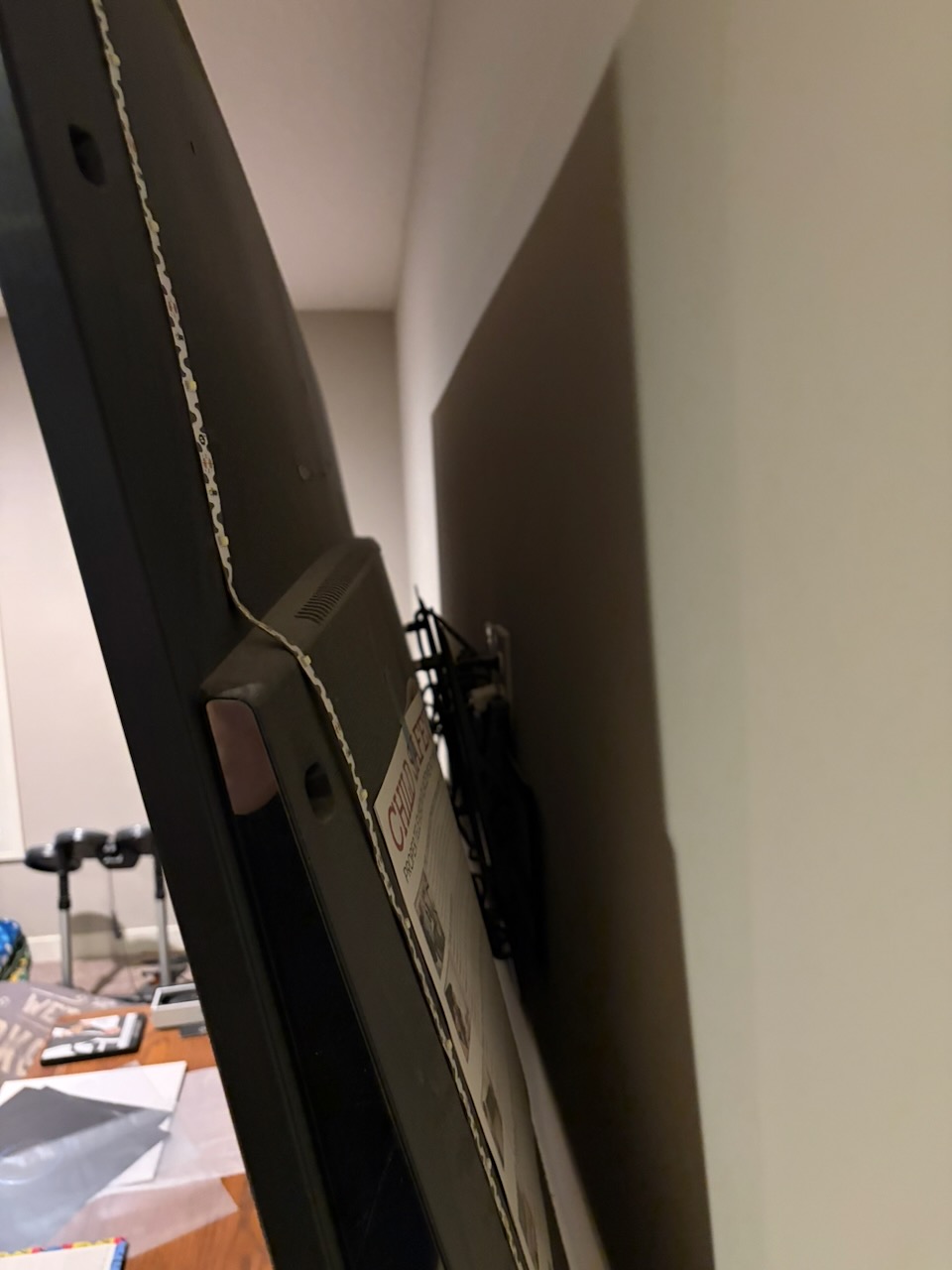Close-up of the space behind the TV and the wall